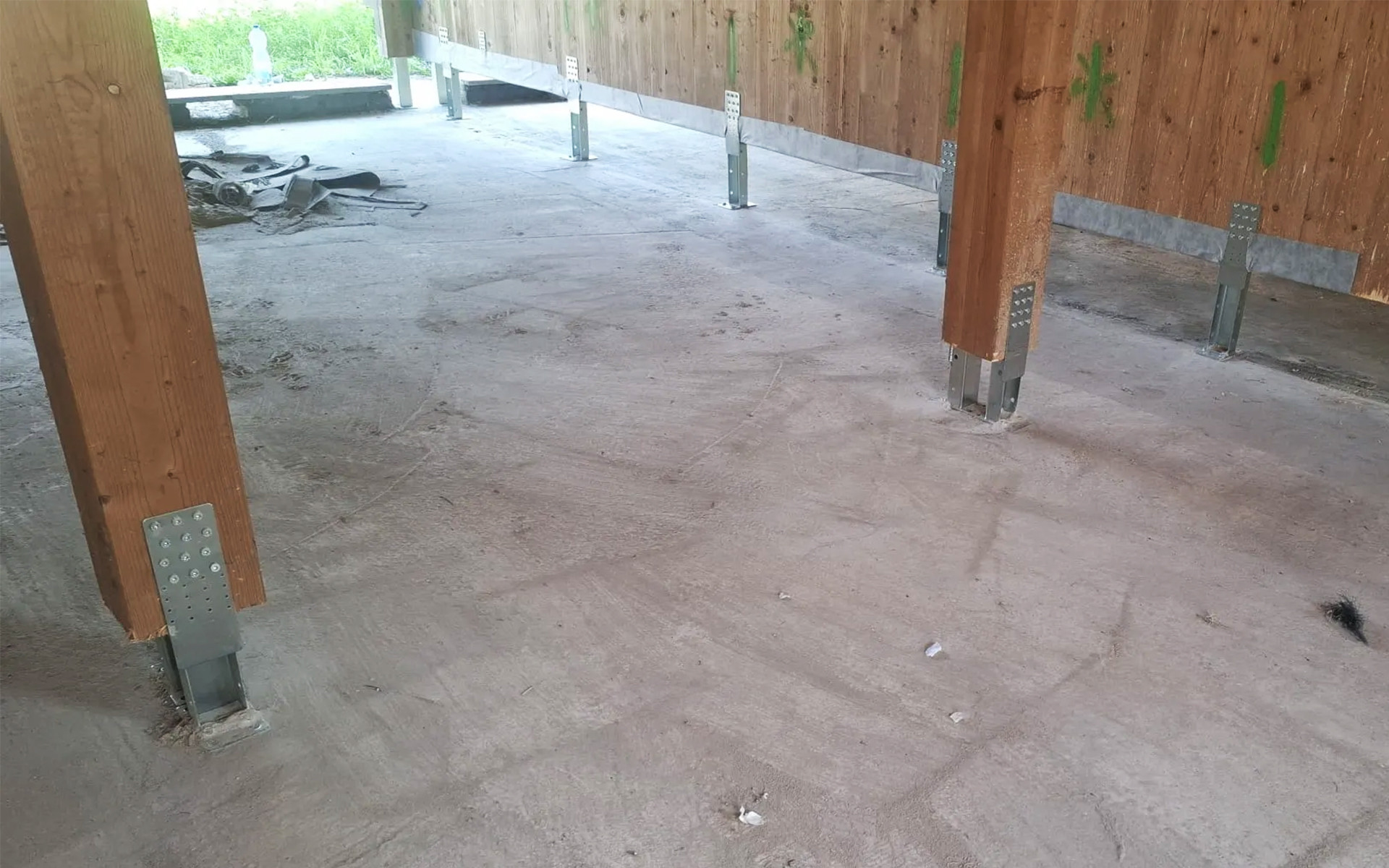 UP LIFT system installed for timber building retrofit, lifting X-LAM structure during base connection upgrade